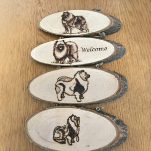 wooden plaques with Keeshonds